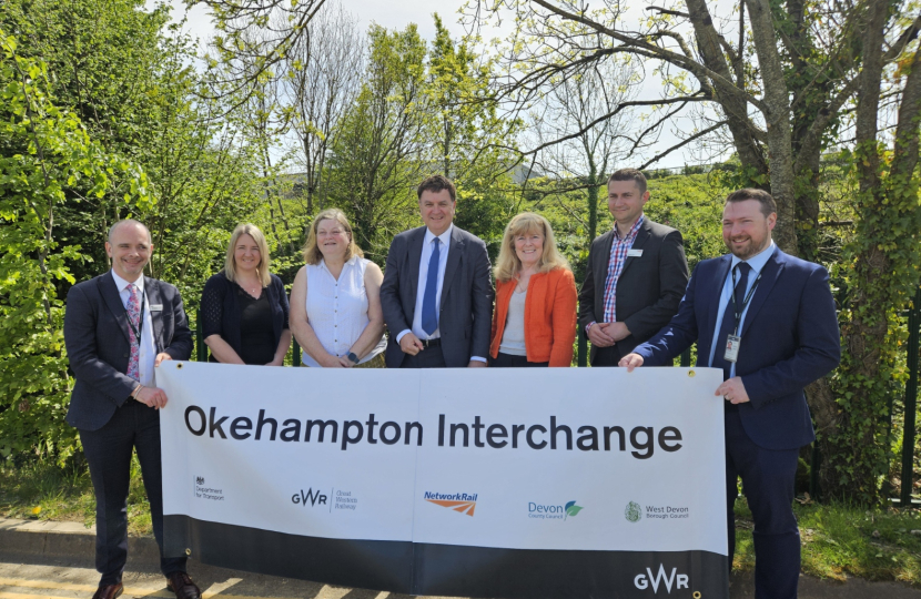 Left to right: Ian Mundy (GWR Senior Portfolio Manager), Councillor Lois Samuel (Devon County Councillor for Okehampton), Councillor Mandy Ewings (Leader of West Devon Borough Council), Mel Stride MP, Councillor Andrea Davis, (Devon County Council Cabinet Member for Climate Change, Environment and Transport), Bogdan Lupu (Network Rail industry programme director), and David Whiteway (GWR Regional Growth Manager).