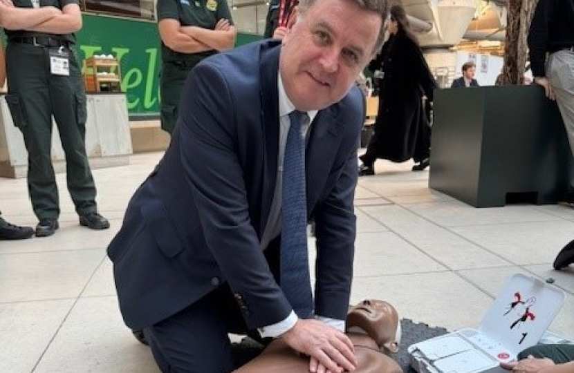 Mel Stride in Parliament receiving CPR training from the London Ambulance Service