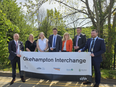 Left to right: Ian Mundy (GWR Senior Portfolio Manager), Councillor Lois Samuel (Devon County Councillor for Okehampton), Councillor Mandy Ewings (Leader of West Devon Borough Council), Mel Stride MP, Councillor Andrea Davis, (Devon County Council Cabinet Member for Climate Change, Environment and Transport), Bogdan Lupu (Network Rail industry programme director), and David Whiteway (GWR Regional Growth Manager).