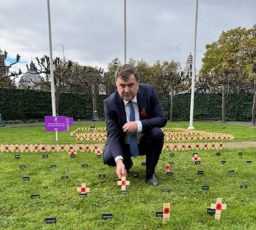 Mel Stride, MP for Central Devon, placing his constituency’s cross in the Constituency Garden of Remembrance